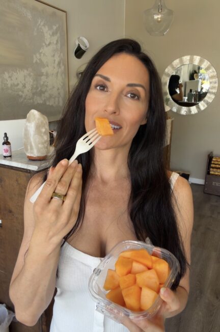 Jennifer Johnson eating fresh cantaloupe during the melon fast at ETERNA HAUS